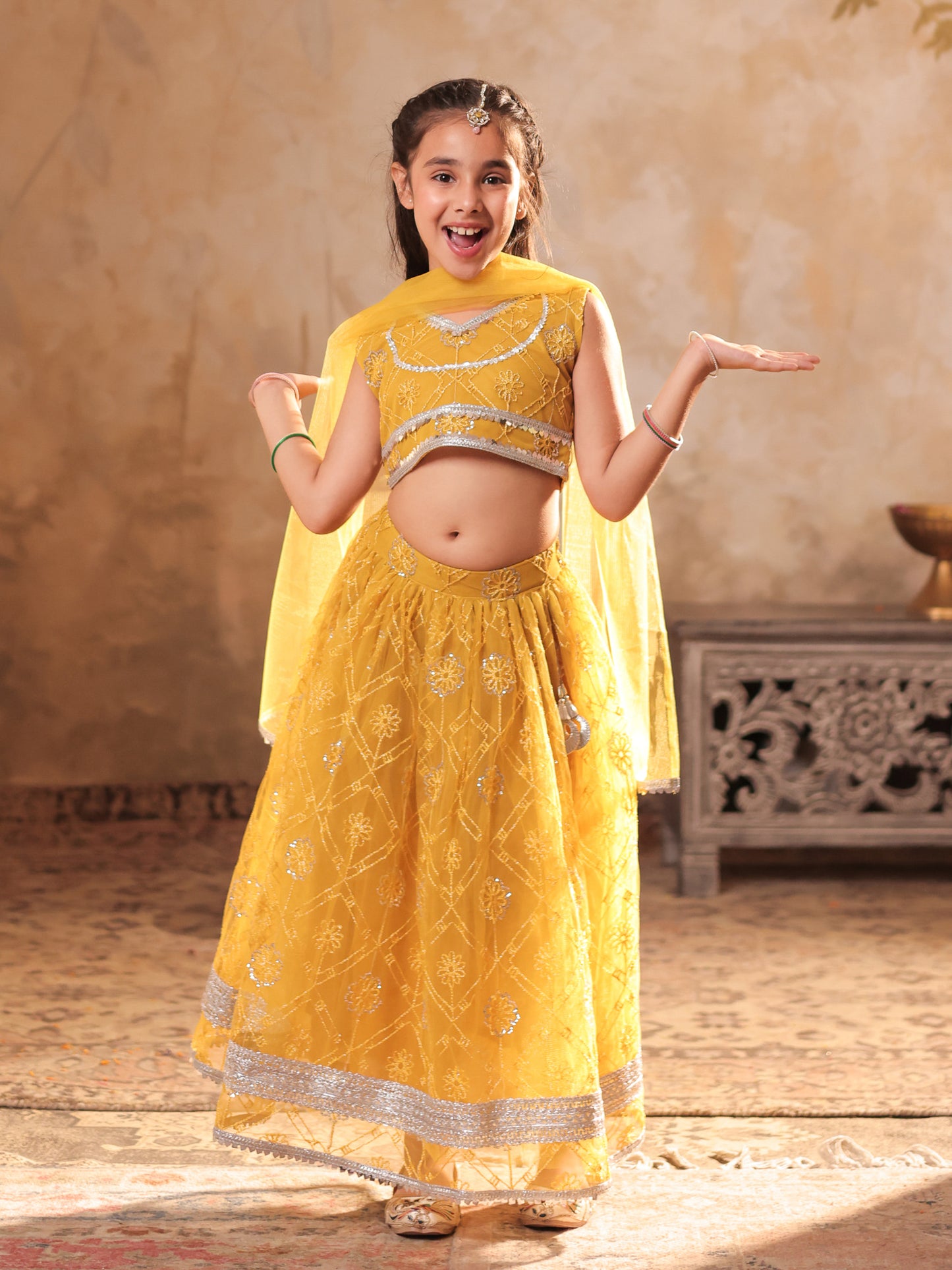Girls Yellow Net Sleeveless Heavy Embroidered Lehenga Choli