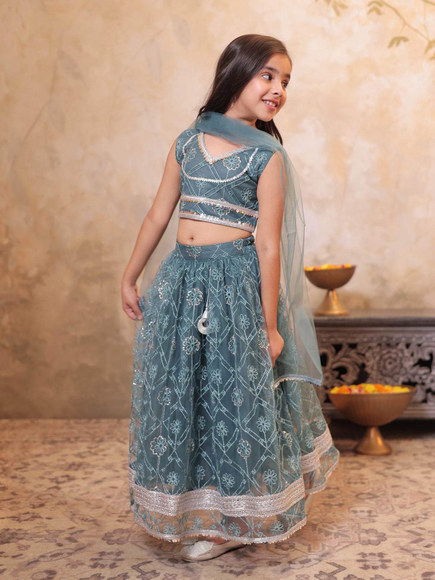 Girls Teal Net Sleeveless Heavy Embroidered Lehenga Choli