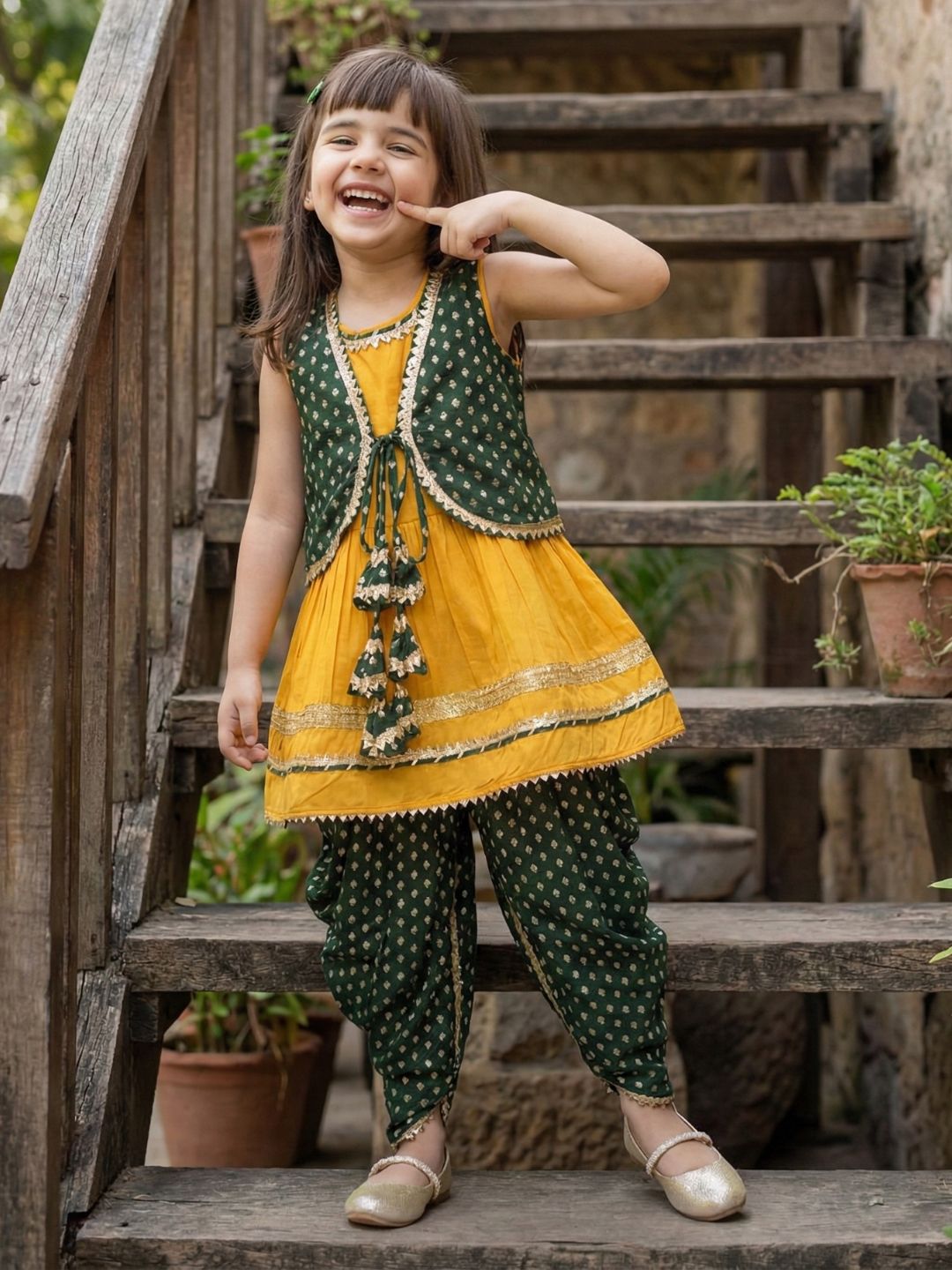 Aj Dezines Yellow Poly Chanderi Sleeveless Motif Print Girls Dhoti Style Suit Set With Dark Green Half Jacket For Girls