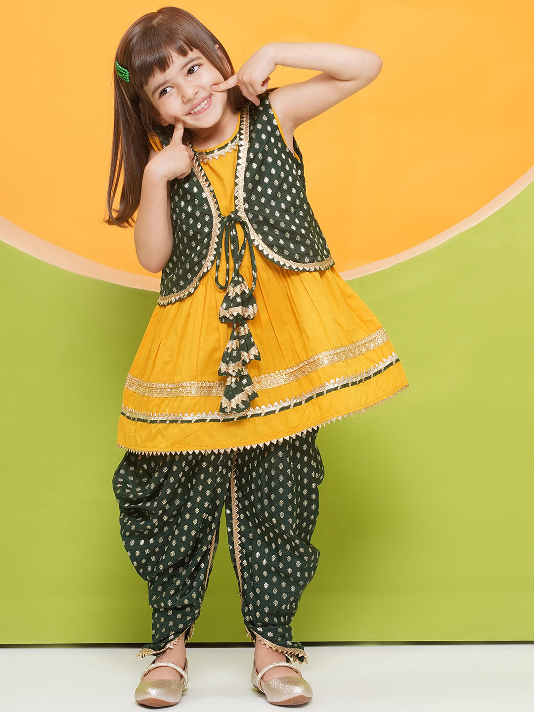 YELLOW Poly Chanderi Sleeveless Motif Print Girls Dhoti Style Suit Set with DARK GREEN half jacket for Girls