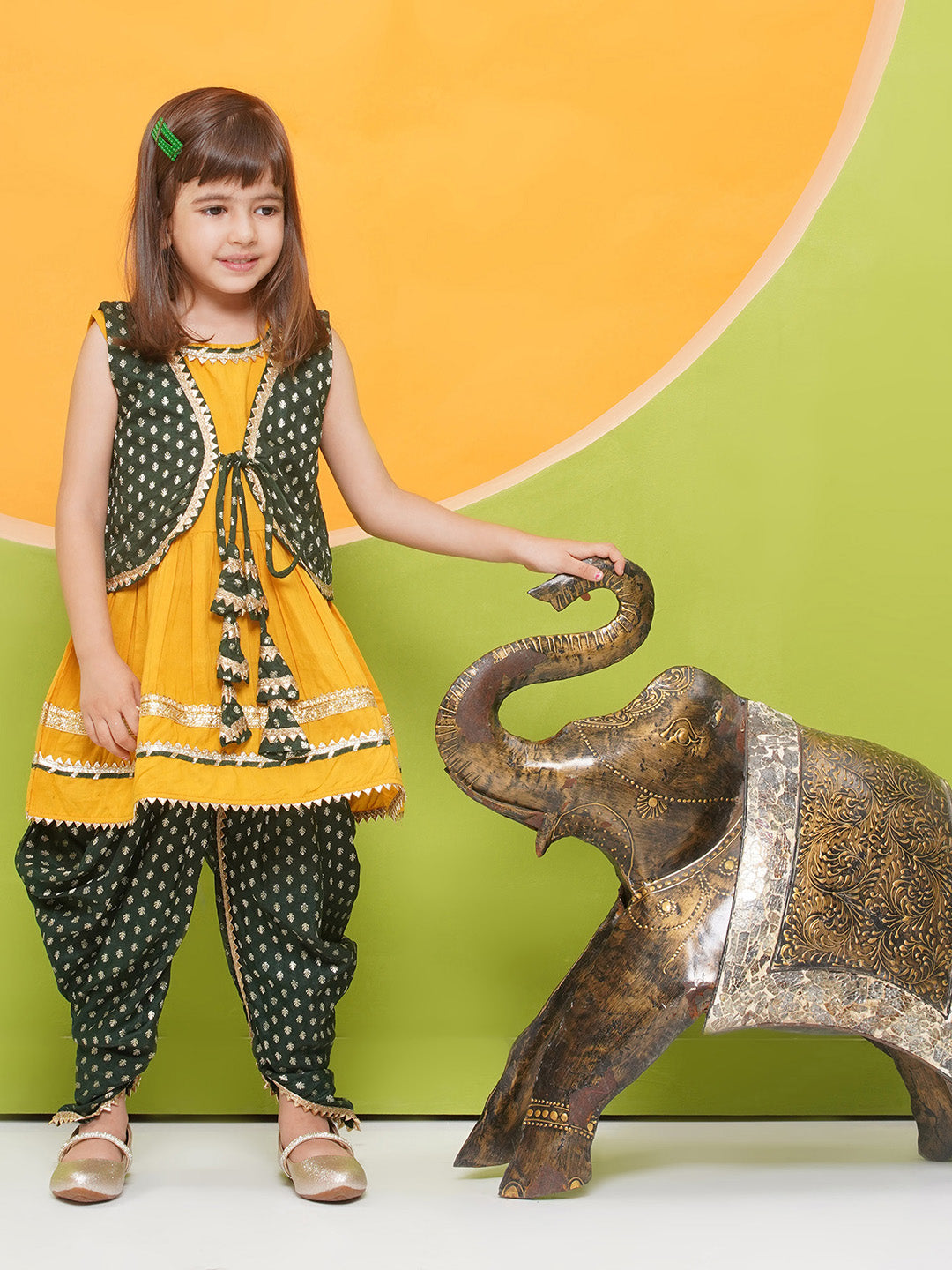 YELLOW Poly Chanderi Sleeveless Motif Print Girls Dhoti Style Suit Set with DARK GREEN half jacket for Girls