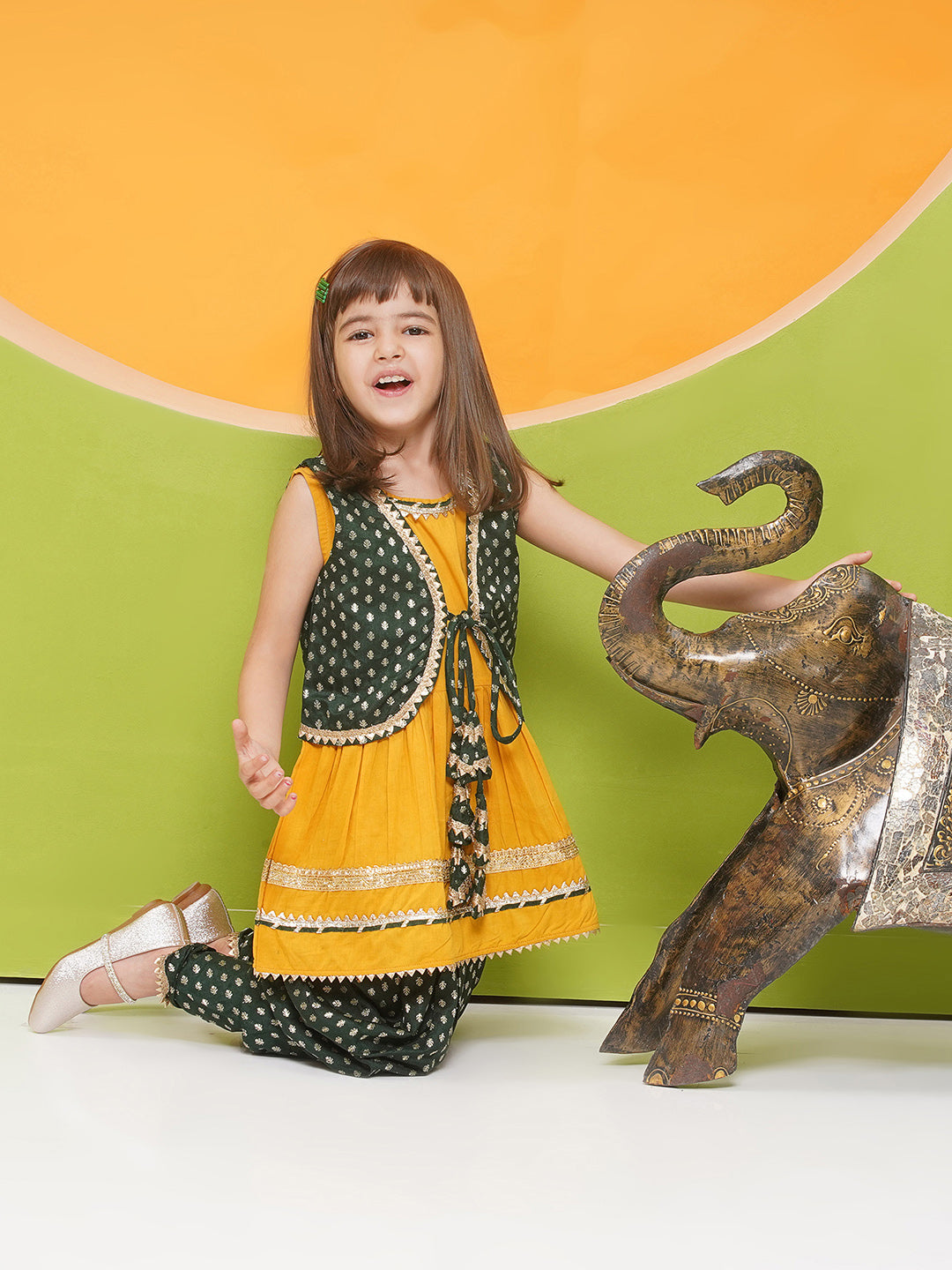 YELLOW Poly Chanderi Sleeveless Motif Print Girls Dhoti Style Suit Set with DARK GREEN half jacket for Girls