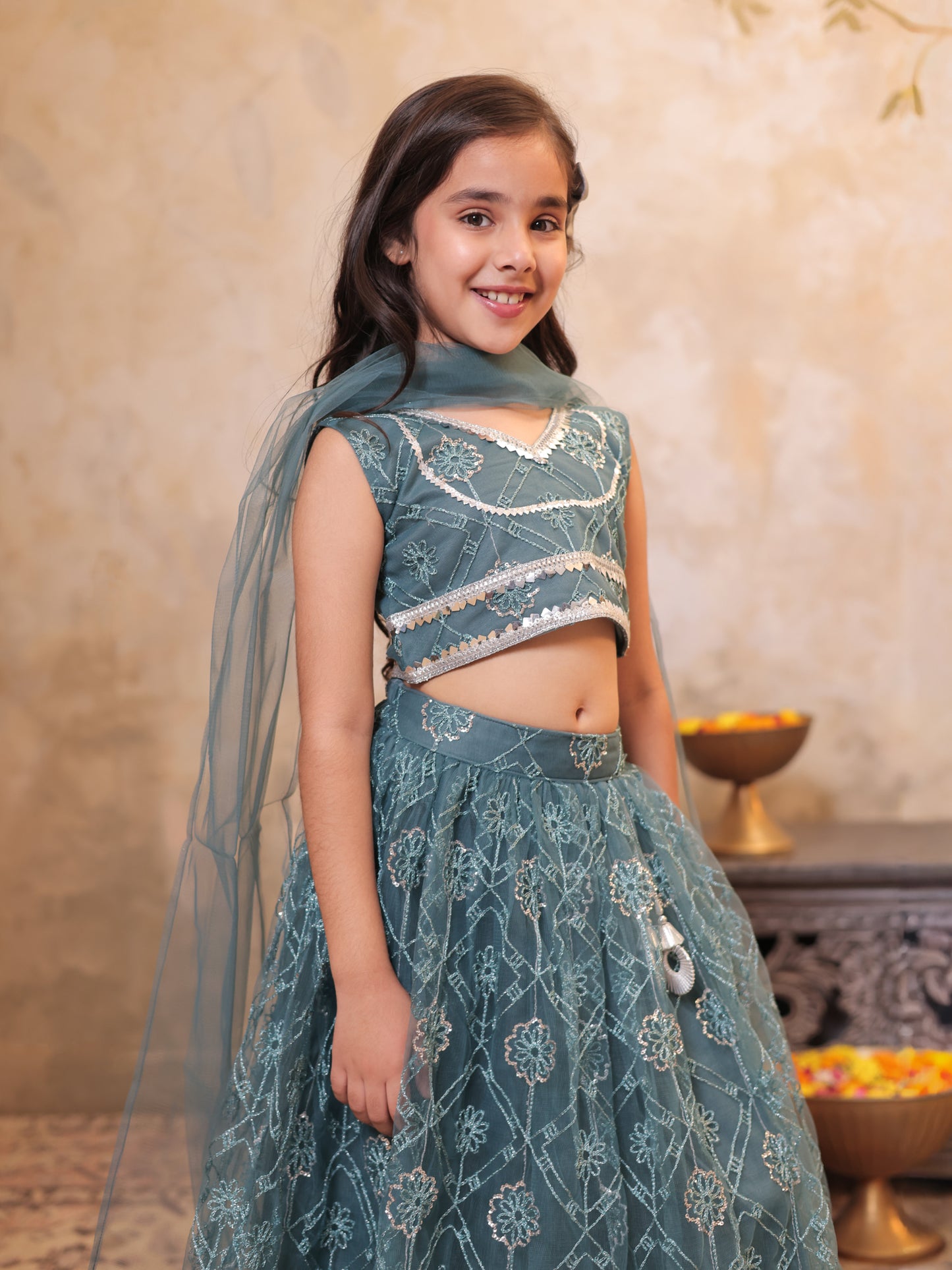 Girls Teal Net Sleeveless Heavy Embroidered Lehenga Choli