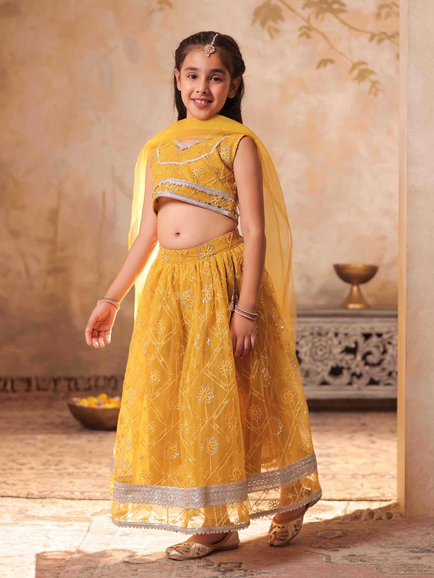 Girls Yellow Net Sleeveless Heavy Embroidered Lehenga Choli
