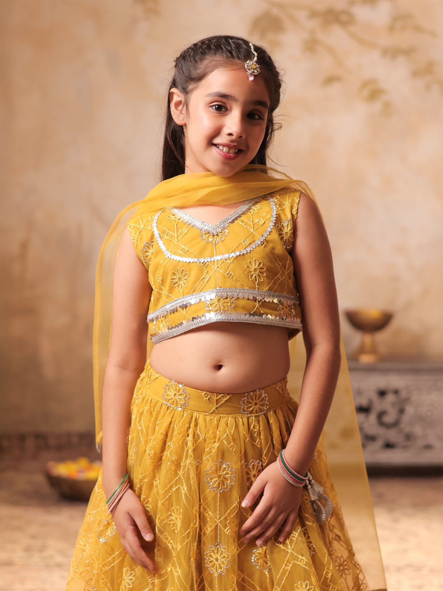 Girls Yellow Net Sleeveless Heavy Embroidered Lehenga Choli
