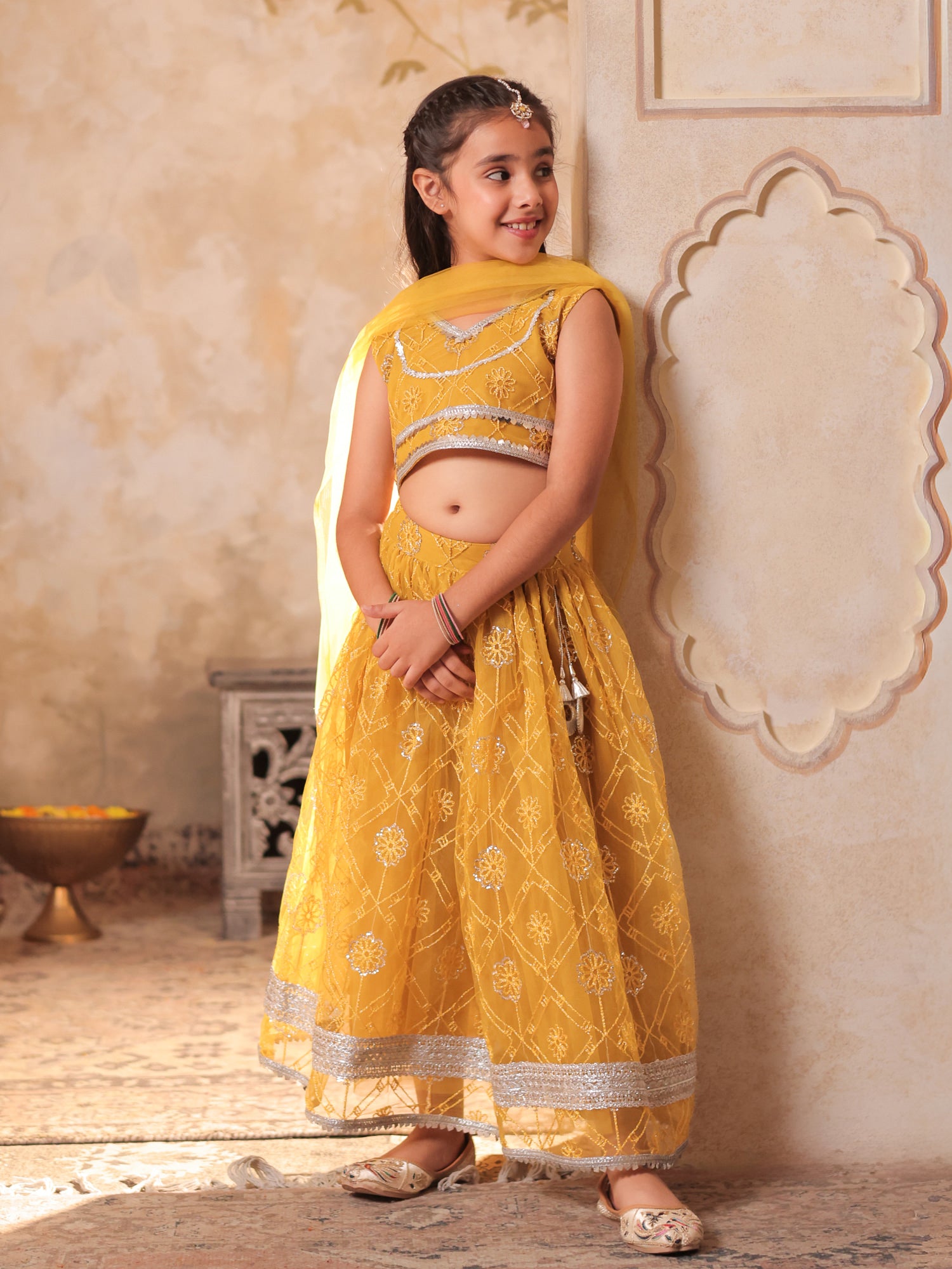 Girls Yellow Net Sleeveless Heavy Embroidered Lehenga Choli