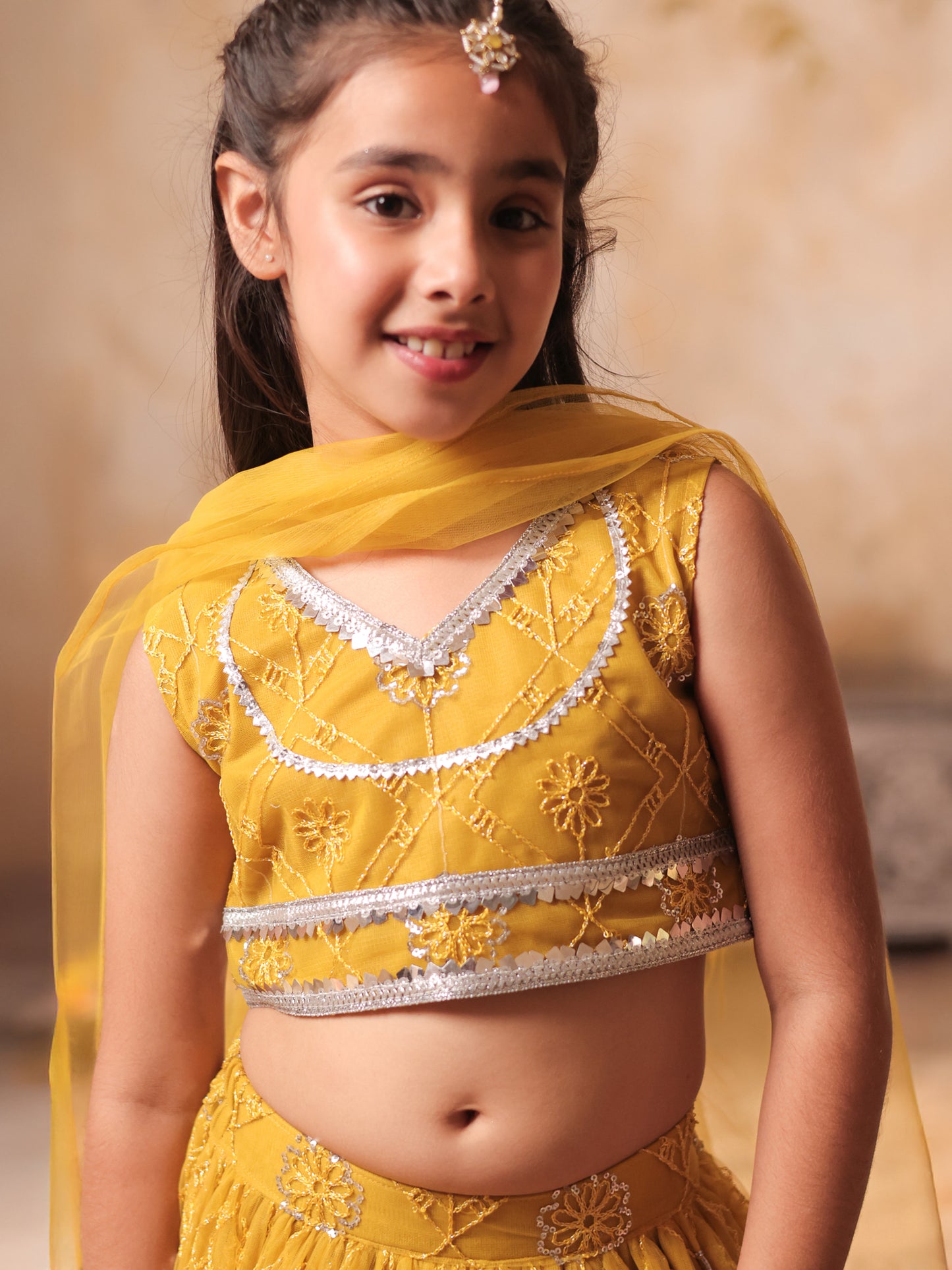 Girls Yellow Net Sleeveless Heavy Embroidered Lehenga Choli