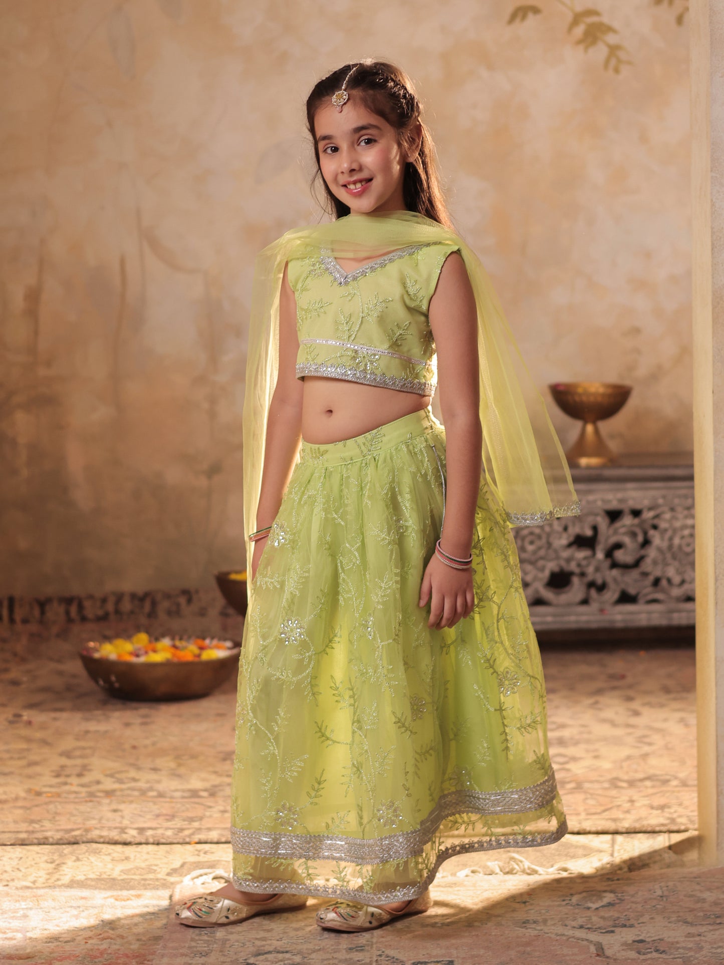 Girls Lime Green Net Sleeveless Heavy Embroidered Lehenga Choli