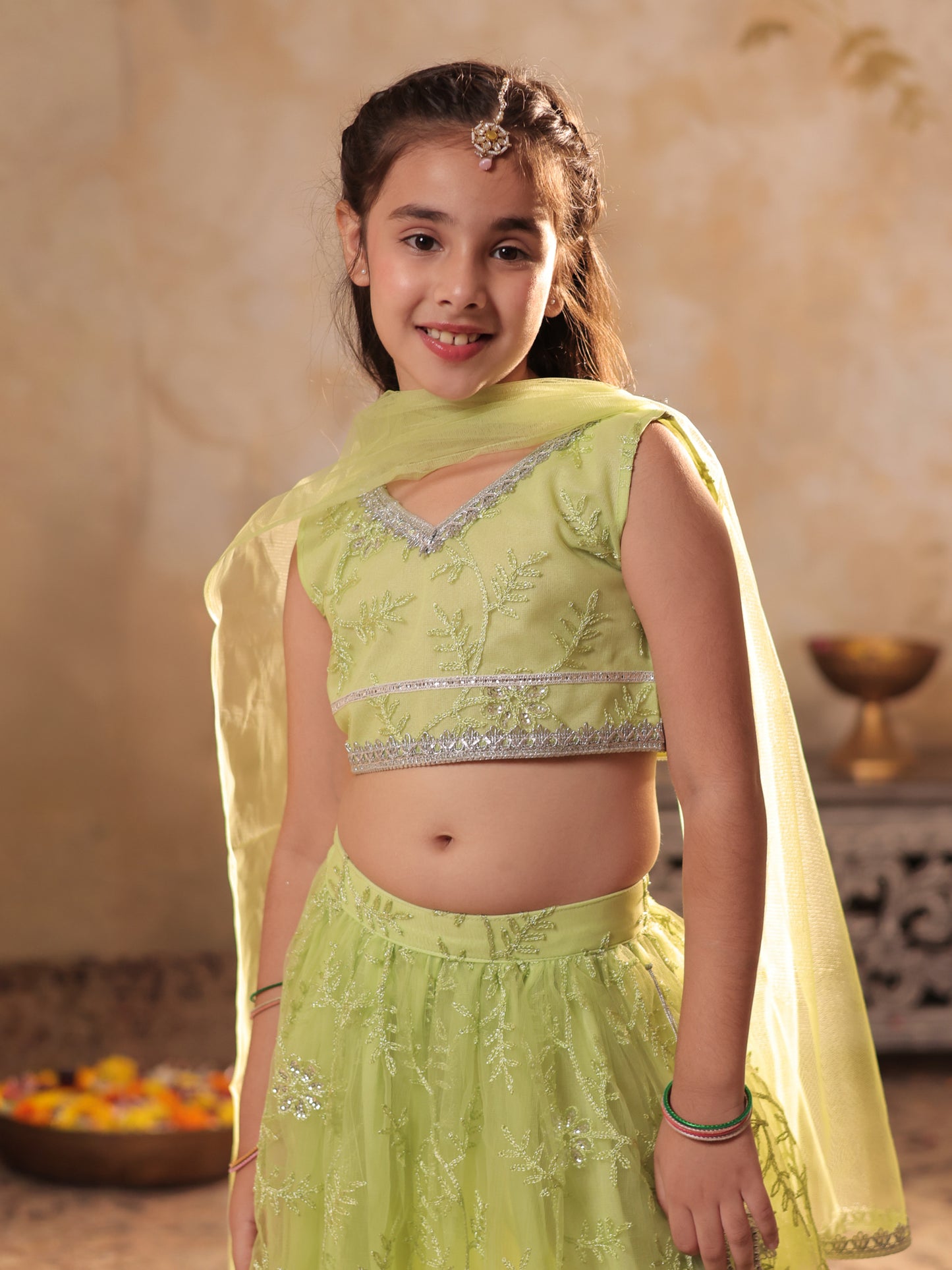 Girls Lime Green Net Sleeveless Heavy Embroidered Lehenga Choli