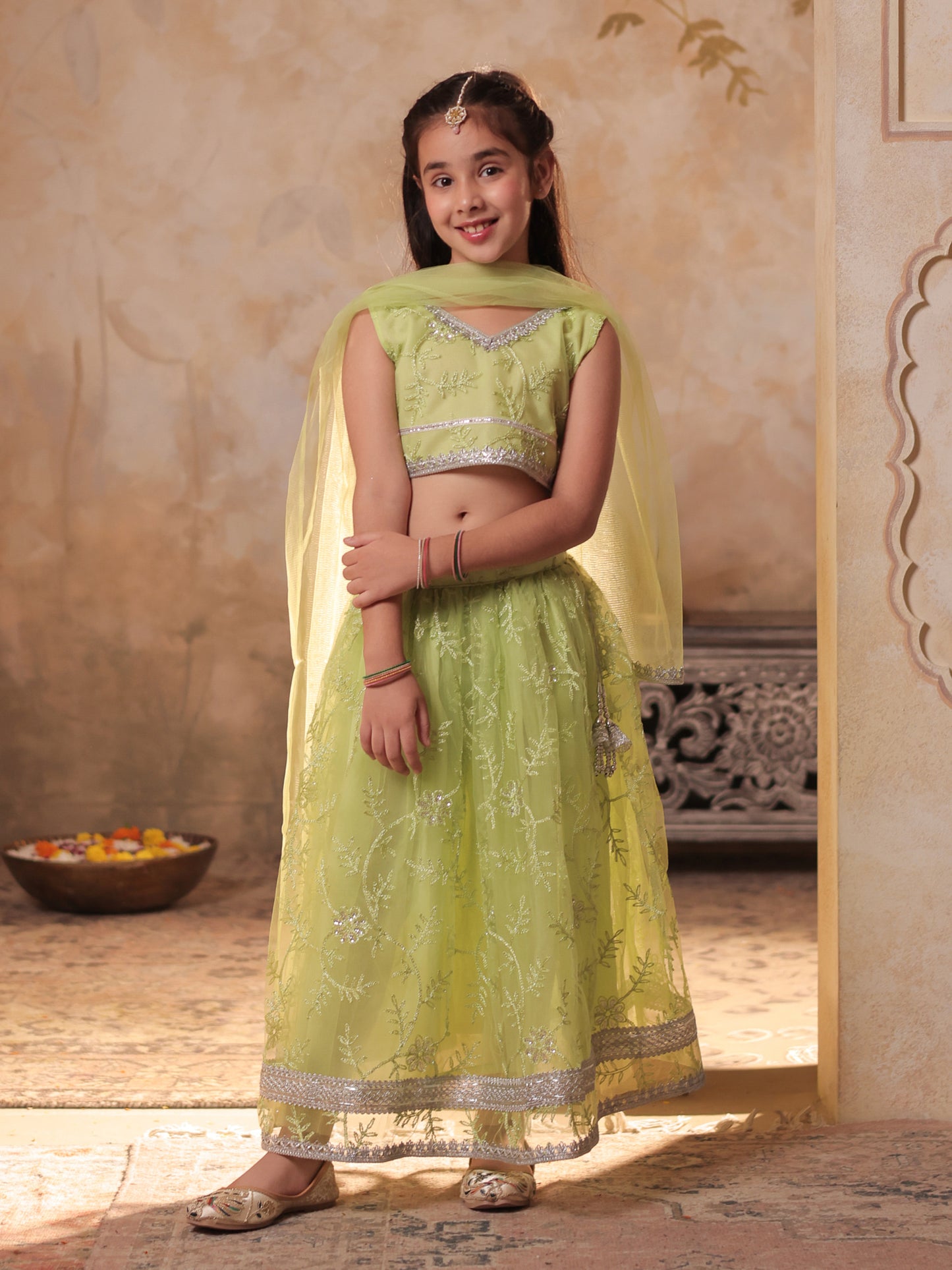 Girls Lime Green Net Sleeveless Heavy Embroidered Lehenga Choli