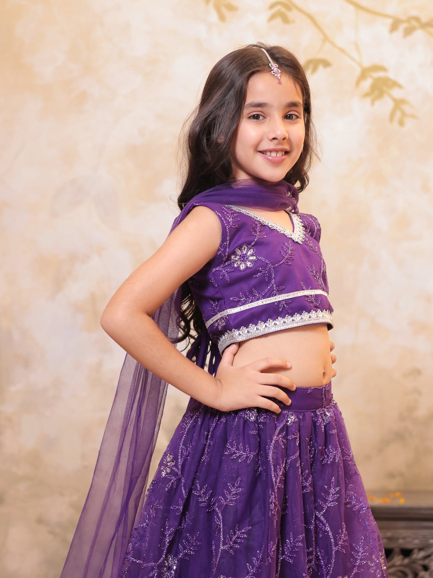 Girls Purple Net Sleeveless Heavy Embroidered Lehenga Choli